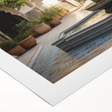 Art deco poster featuring a geometric fountain design in muted teal and gray on rolled canvas.