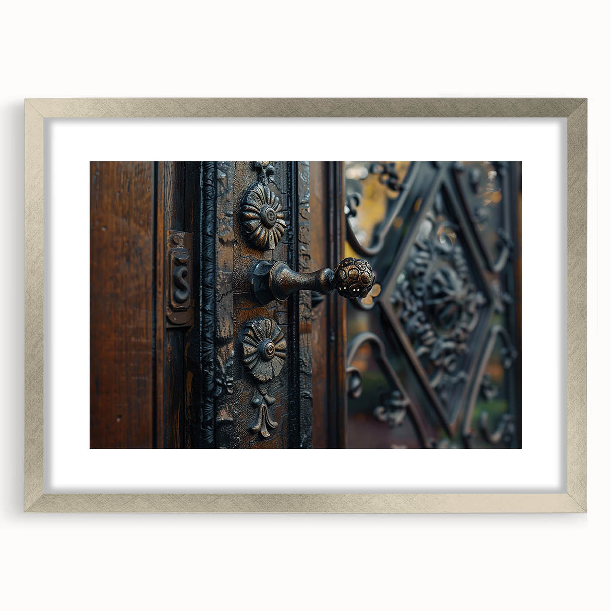Abstract art print featuring geometric shapes in muted gray and silver tones, framed with a silver mat.