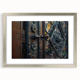 Abstract art print featuring geometric shapes in muted gray and silver tones, framed with a silver mat.