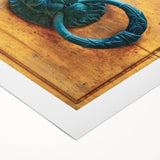 Art deco poster featuring geometric patterns in muted gold and navy, printed on rolled canvas.