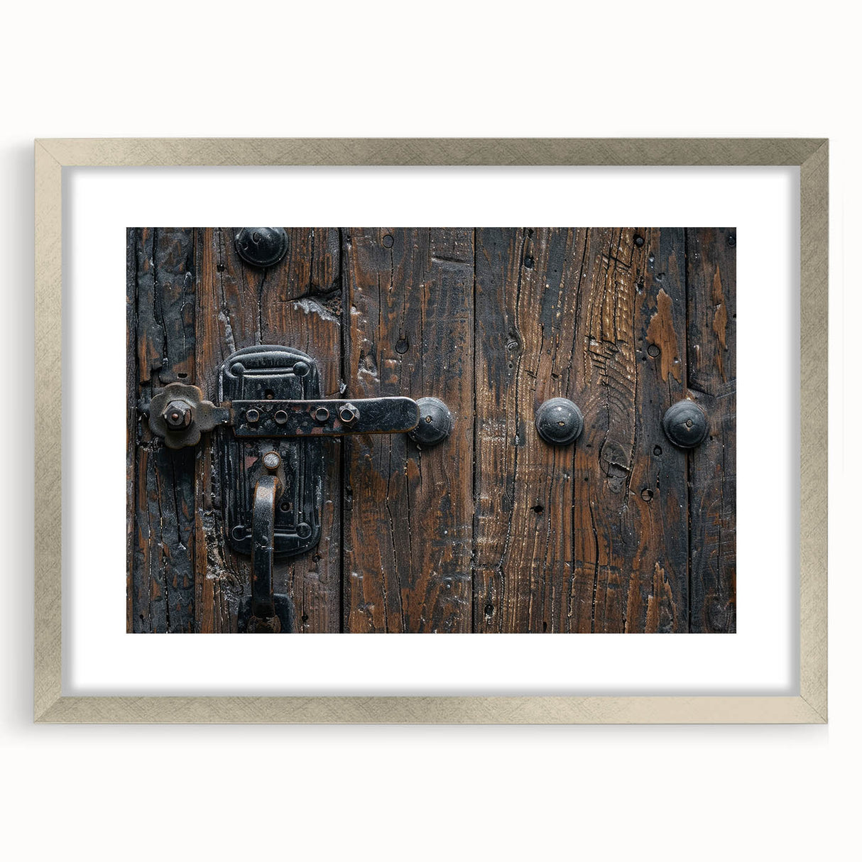 Abstract art print featuring geometric shapes in muted gray and silver on a framed canvas.