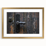 Textured abstract art print in muted gold and beige, framed in gold, suitable for bedroom decor.