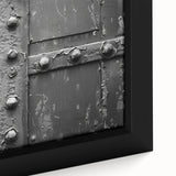 Close-up of a black framed canvas featuring a textured, colorful abstract design, ideal for living room decor.