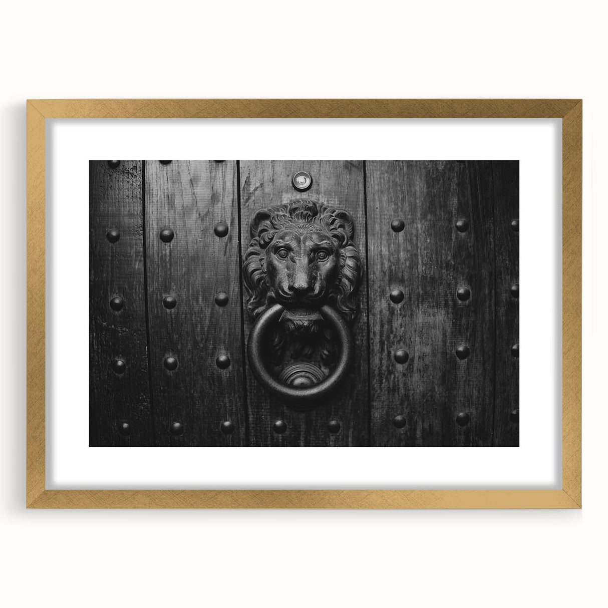 Textured abstract art print in gold and beige tones on a framed canvas, suitable for bedroom decor.