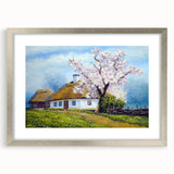 Textured abstract art print of architectural houses in muted gray tones, framed in silver, ideal for modern bedroom decor.