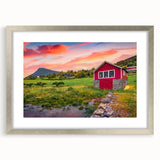 Textured abstract art print of architectural houses in muted gray and white, framed in silver.