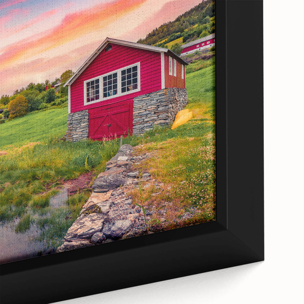 Black wall art featuring a close-up of colorful, textured architecture houses on a framed canvas.