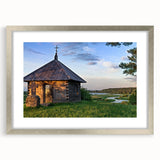 Textured abstract art print featuring a mix of gray and silver tones, displayed in a silver frame.