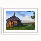 Abstract art prints featuring geometric shapes in muted gray and blue tones on a framed canvas.