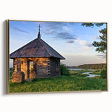 Framed canvas featuring a vintage landscape painting of houses, in muted earth tones, ideal for bedroom decor.