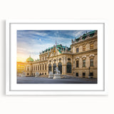 Abstract art print featuring geometric shapes in muted gray and blue tones on a white framed canvas.