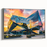 Landscape art painting of a vintage poster featuring colorful, abstract designs on a black background, framed in silver.