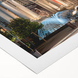 Art deco poster of a geometric building in muted gold and navy tones, ideal for dining room wall art.