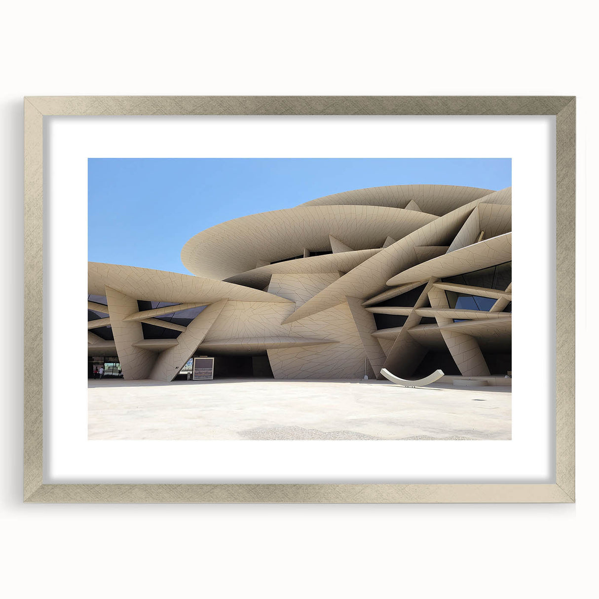 Textured abstract art print in muted grays and whites, framed in silver, ideal for bedroom wall decor.