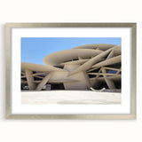 Textured abstract art print in muted grays and whites, framed in silver, ideal for bedroom wall decor.