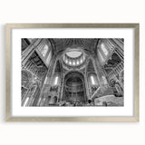 Textured abstract art print in silver frame, featuring swirling gray and white patterns, suitable for bedroom decor.