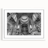 Abstract art prints featuring geometric shapes in muted gray and blue tones on a white framed canvas.