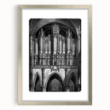 Textured abstract art print in silver frame, featuring dynamic shapes in muted gray, ideal for modern bedroom decor.