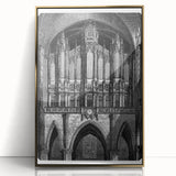 Mid-century modernist acrylic print of abstract architecture in gold and black tones, framed.