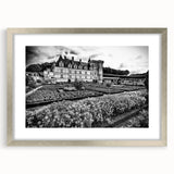 Abstract art print of a geometric palace design in muted gray tones, framed in silver, suitable for dining room decor.