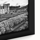 Close-up of a black wall art on framed canvas featuring a colorful, textured depiction of a palace architecture.