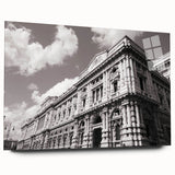 Large abstract wall art on acrylic glass, featuring a blend of muted blues and grays, ideal for bedroom or dining room decor.