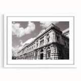 Extra large abstract art print featuring textured design of a palace, in muted earth tones, framed with a white mat.