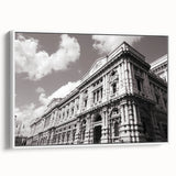 Framed canvas of a vintage-style landscape painting featuring a palace, in muted earth tones.