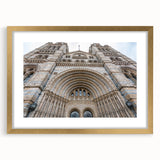 Textured abstract art print of a palace design in gold and beige tones on a framed mat, suitable for bedroom decor.