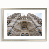 Abstract art print of a palace, in muted gray and blue tones, framed with a silver mat, suitable for dining room decor.