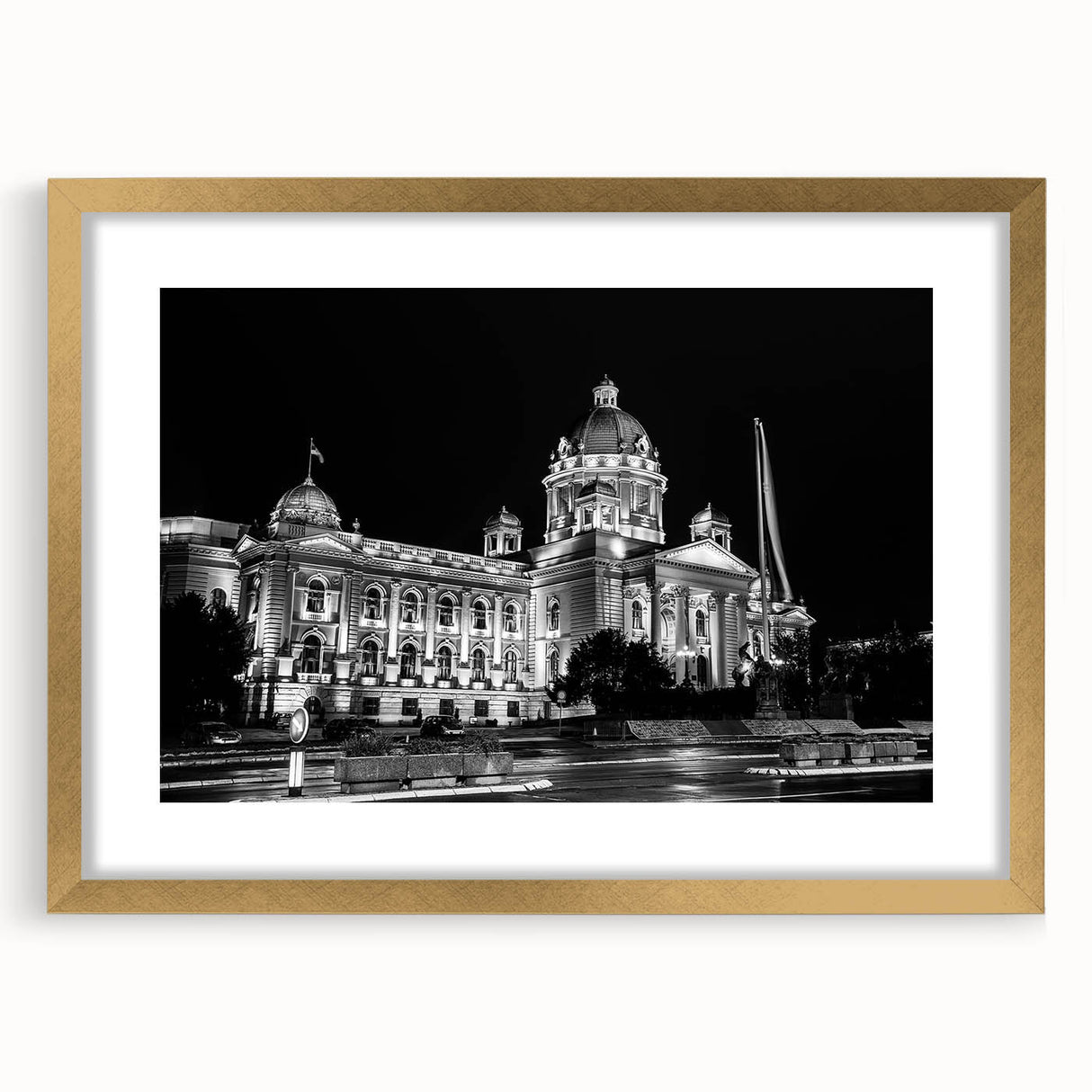 Textured abstract art print of a palace design in muted gold and beige tones, framed with a golden mat.