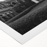 Art Deco poster featuring a geometric palace design in muted gold and navy tones on rolled canvas.