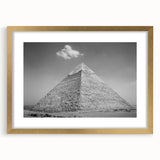 Textured art of abstract pyramids in muted gold and beige on a framed canvas, suitable for bedroom decor.