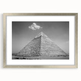 Abstract art print of geometric pyramids in silver frame, ideal for modern dining room decor.