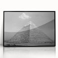 Large abstract wall art depicting geometric pyramids in black and gray tones on a framed acrylic.