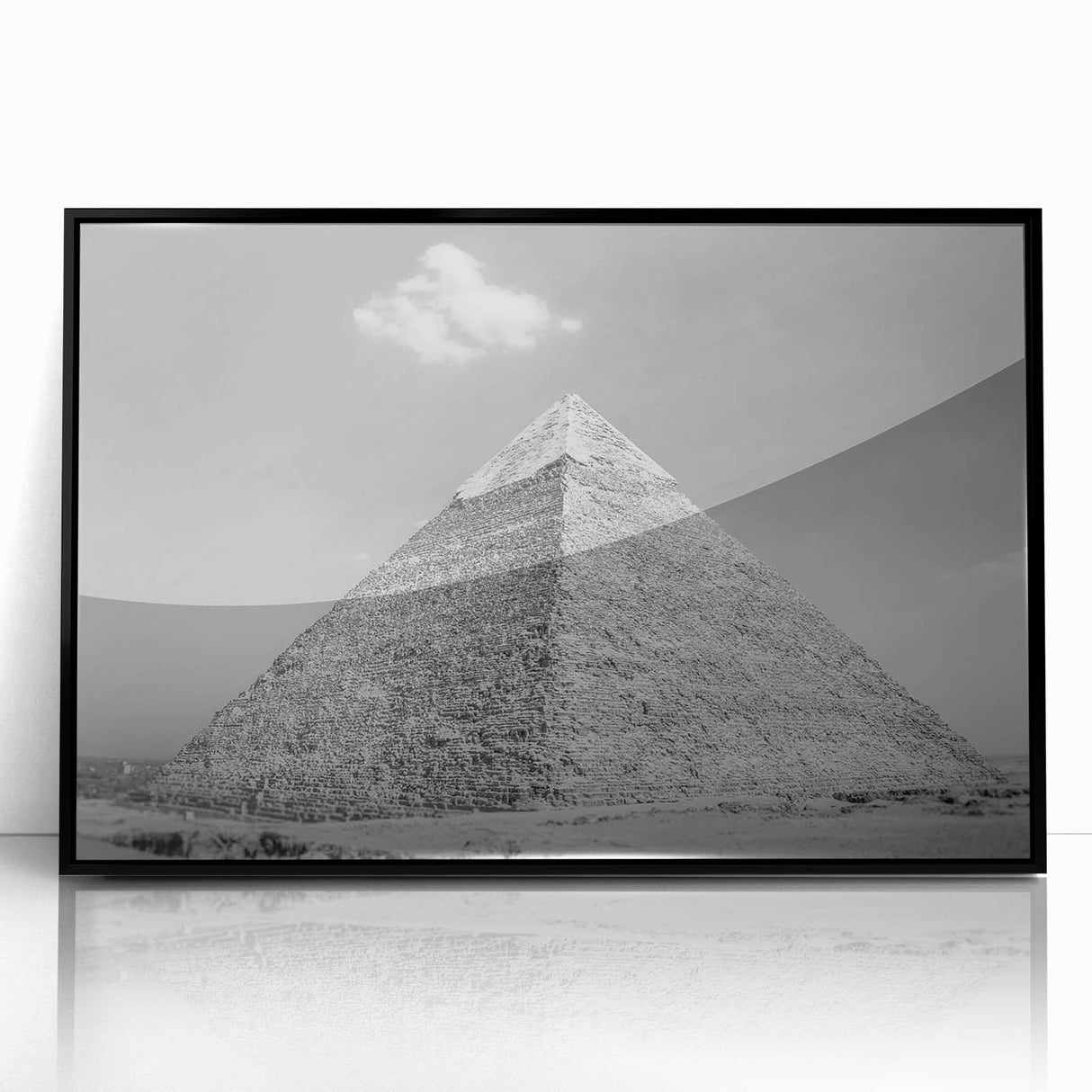 Large abstract wall art depicting geometric pyramids in black and gray tones on a framed acrylic.