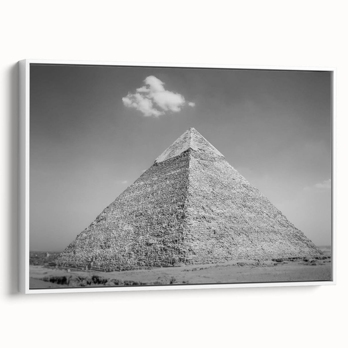 Framed canvas featuring a vintage poster art style depiction of pyramids in a landscape, with muted black and white tones.