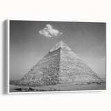 Framed canvas featuring a vintage poster art style depiction of pyramids in a landscape, with muted black and white tones.