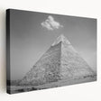 Graphic print of pyramids in muted beige and ivory tones on stretched canvas, suitable for kitchen wall art.