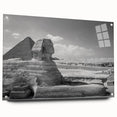 Large abstract wall art of geometric pyramids in muted earth tones on acrylic glass.