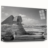 Large abstract wall art of geometric pyramids in muted earth tones on acrylic glass.