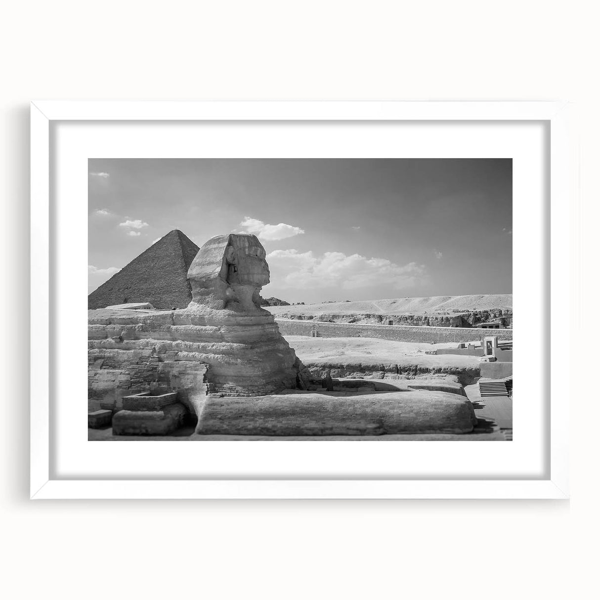 Extra large abstract art print of textured pyramids, in muted earth tones on a white framed canvas.