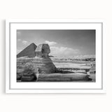 Extra large abstract art print of textured pyramids, in muted earth tones on a white framed canvas.