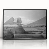 Large abstract wall art featuring geometric pyramids in muted gray, framed in black acrylic.
