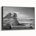 Black and white framed canvas featuring a vintage poster art style depiction of pyramids, ideal for bedroom wall decor.