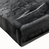 Large art depicting a black and white landscape of pyramids, printed on stretched canvas, suitable for bedroom decor.