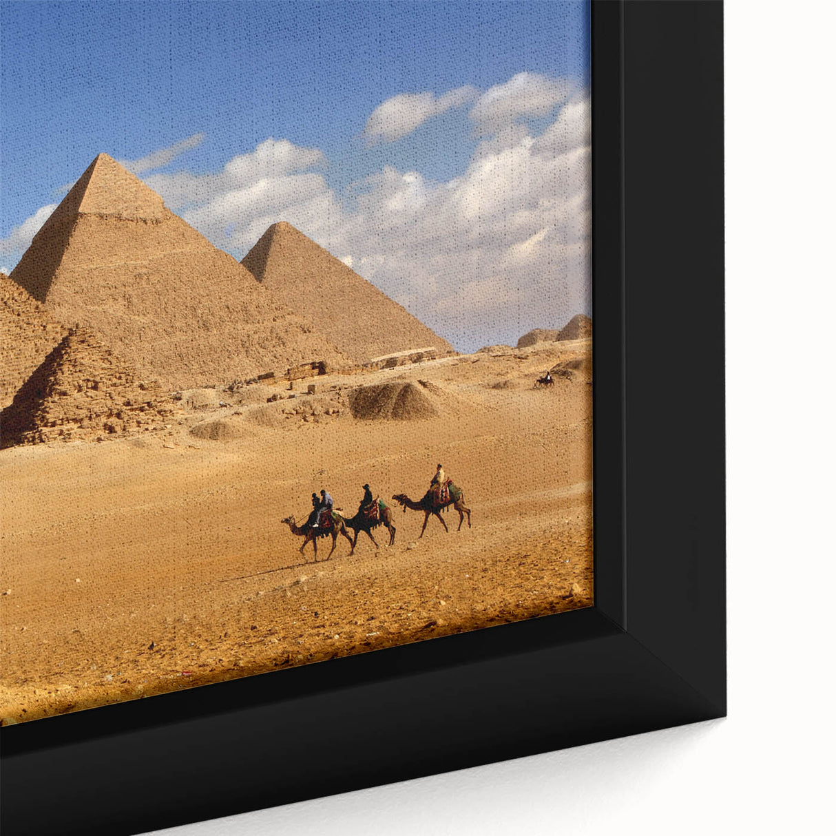 Extra large framed canvas featuring a textured depiction of black pyramids with colorful accents.