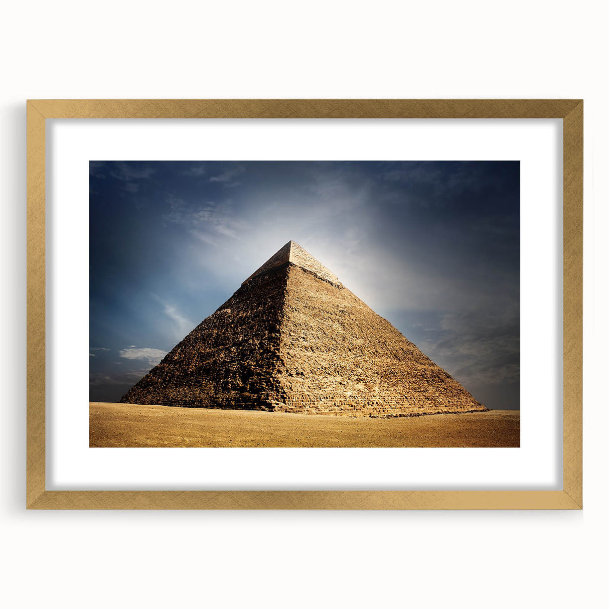Textured art featuring abstract pyramids in gold and beige tones, framed with a gold mat, suitable for bedroom decor.