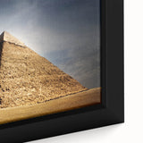 Extra large framed canvas featuring a black textured depiction of pyramids with colorful accents.