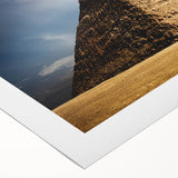 Art deco poster of geometric pyramids in muted gold and black, rolled canvas, ideal for dining room wall art.